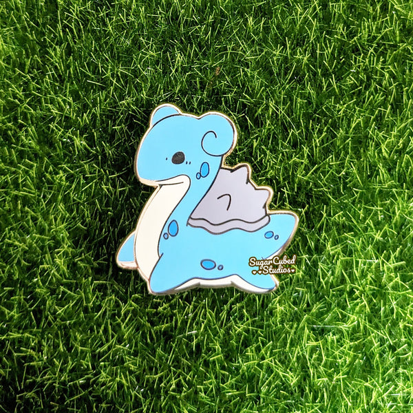 the blue and shiny version of the prized pocket monster enamel pin